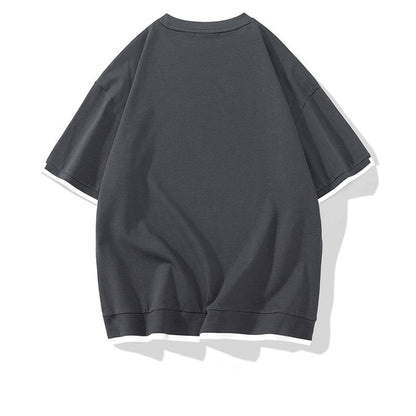 Camiseta de manga corta de algodón puro con corte holgado y hombros caídos de moda.