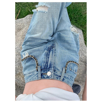 Jeans largos desgastados con bordado artesanal