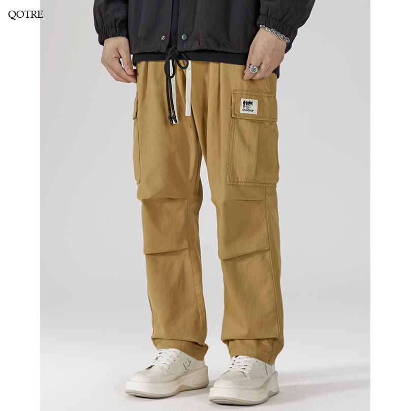 Pantalones de carga casuales de pierna ancha y recta con bolsillos de solapa sueltos.