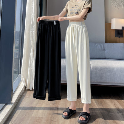 Pantalones de corte recto y pierna ancha de seda de harem de seda de hielo para uso informal.