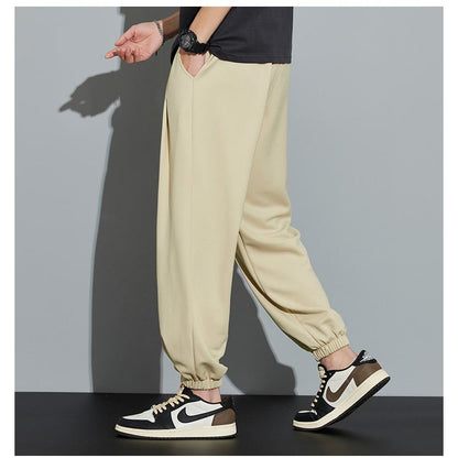 Pantalón de chándal informal de punto, color sólido, corte holgado y cónico.