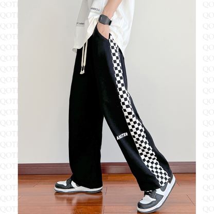 Pantalón de chándal de estilo callejero tejido deportivo de corte entallado y suelto.
