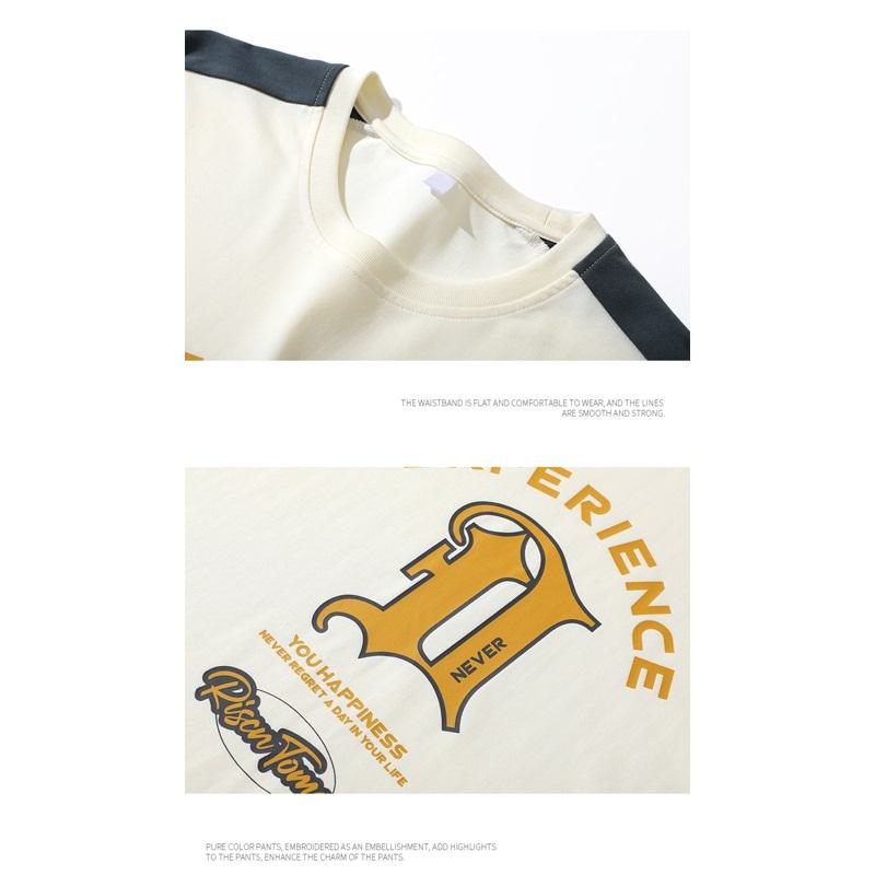 Camiseta de manga corta suelta de hombro caído y bloques de color de algodón puro.