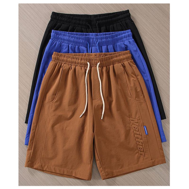Pantalones cortos de cintura ajustable con bolsillos inclinados y cordón