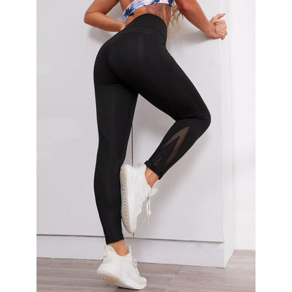 Eng anliegende Yoga-Leggings mit hoher Taille und elastischem Mesh für Fitness.