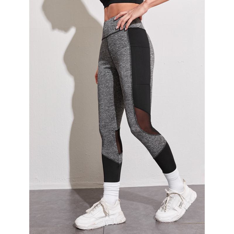 Leggings deportivos ajustados con bolsillo para entrenamiento de yoga y running con malla de parches.
