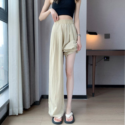 Pantalon en lin et coton soyeux, ample et taille haute, idéal pour une protection solaire et une tenue décontractée.