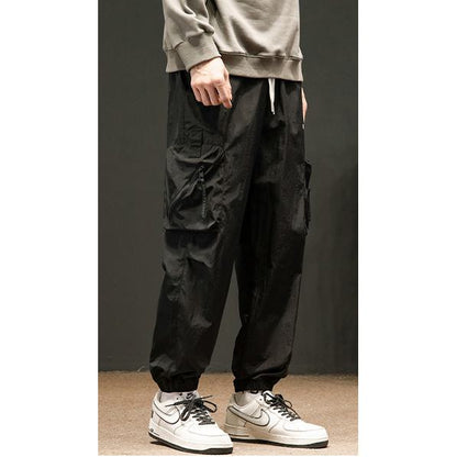 Pantalones de carga informales con ajuste elástico y corte holgado y delgado.