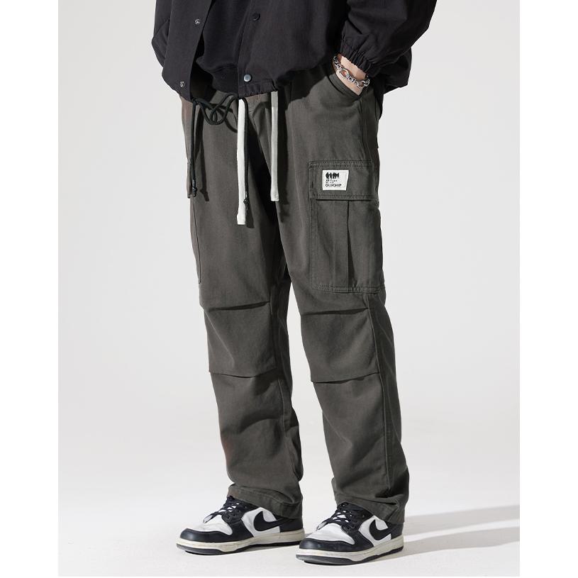 Pantalones de carga casuales de pierna ancha y recta con bolsillos de solapa sueltos.