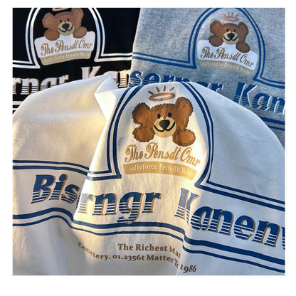 Lockeres Baumwoll-T-Shirt mit V-Ausschnitt, Bärenmotiv und kurzen Ärmeln.
