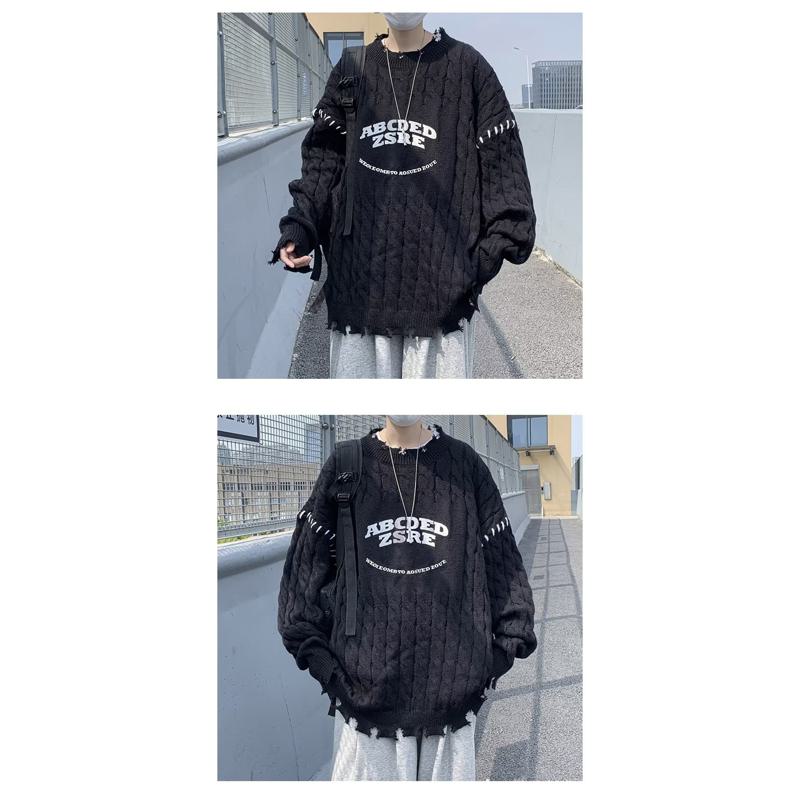 Suéter negro de punto grueso con letras y corte holgado