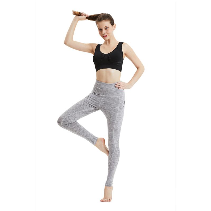 Leggings de sport élastiques avec poche et taille courte pour le fitness, le yoga et les sports.