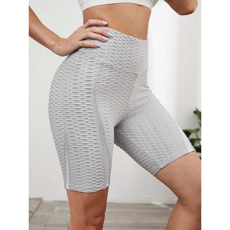 Pantalones cortos deportivos de malla elástica de jacquard para yoga de cintura alta