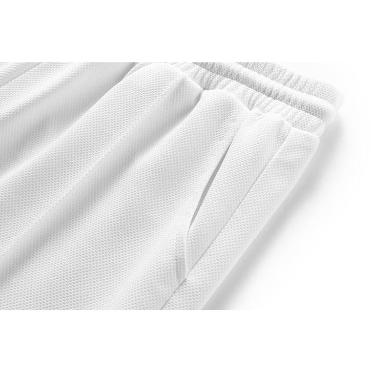 Pantalon en tricot décontracté à cordon de serrage et coupe ample fuselée.