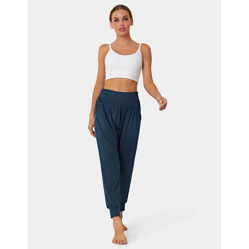 Pantalones deportivos holgados con cintura alta, bolsillos casuales, cordón ajustable y pliegues para yoga.