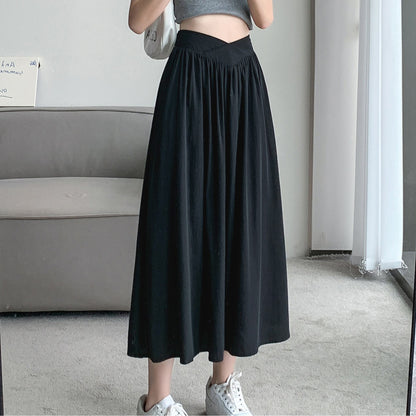 Falda de simplicidad a la cintura, estilo midi y holgada.