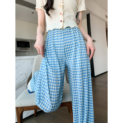 Pantalon à carreaux fins et plissés, à taille haute, jambe droite et longueur jusqu'au sol.