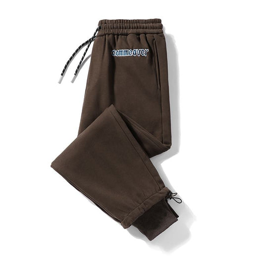Pantalon de survêtement ample en coton pur avec taille élastique et coupe fuselée, broderie