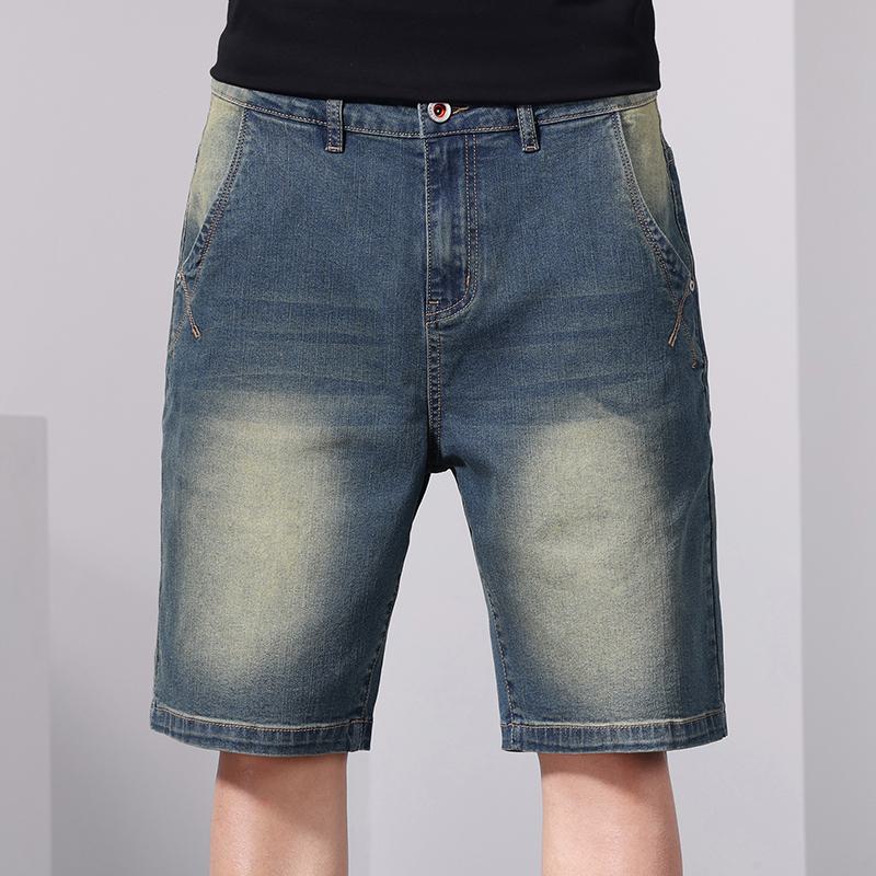 Pantalones cortos de mezclilla lavados de cintura elástica y estilo retro con cordón suelto.
