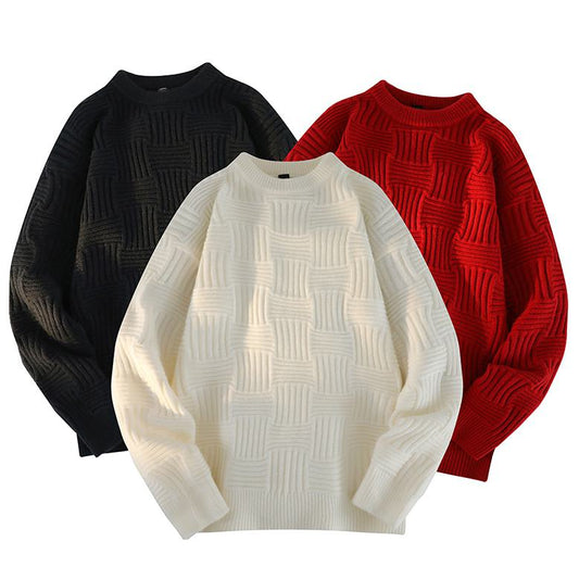 Pull tricoté décontracté à col rond et coupe ample.