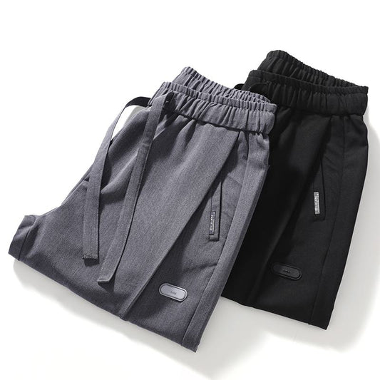 Pantalones casuales de ajuste holgado y versátil con elasticidad
