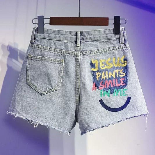 Pantalones cortos de mezclilla de tiro alto, sueltos, desgastados y ensanchados con estampado de graffiti para adelgazar.