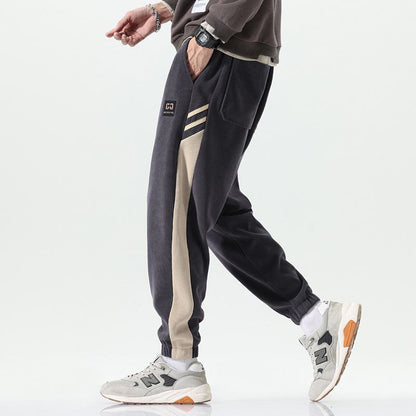 Pantalón de sudor lateral de cintura elástica suelta con parche de elasticidad cónico versátil.