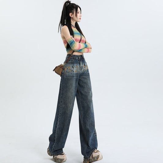 Weite High-Waist-Jeans mit Graffiti-Muster für eine schlanke Silhouette.