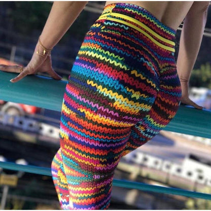 Leggings deportivos elásticos de yoga con rayas arcoíris.