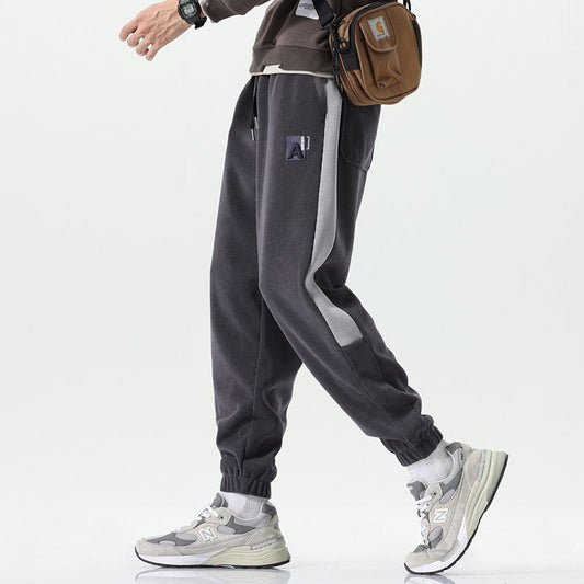 Elastische Sweatpants mit elastischem Bund, lockerer Passform und dicker, vielseitiger Elastizität.