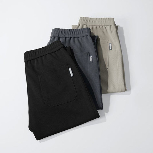 Pantalon ample en tricot confortable, coupe droite et polyvalent, avec élasticité.