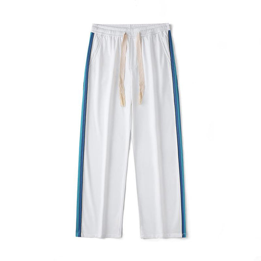Pantalon de sport polyvalent droit et tendance avec taille élastique et coupe ample.