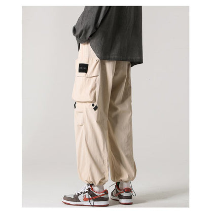Pantalones casuales elásticos y versátiles con bolsillos cónicos y a prueba de agua
