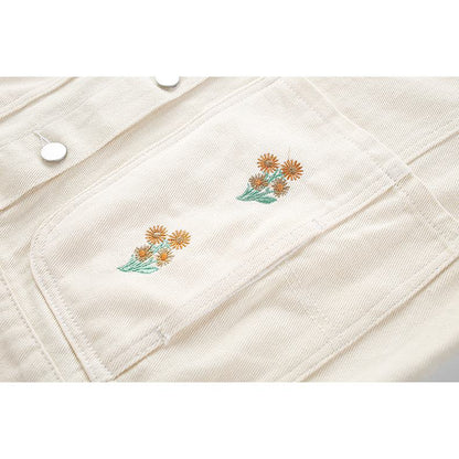 ポケットに花の刺繍が施されたゆったりフィットのウォッシュドデニムジャケット