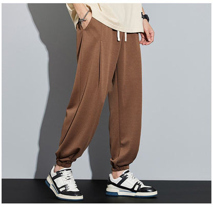 Pantalón de chándal informal de punto, color sólido, corte holgado y cónico.