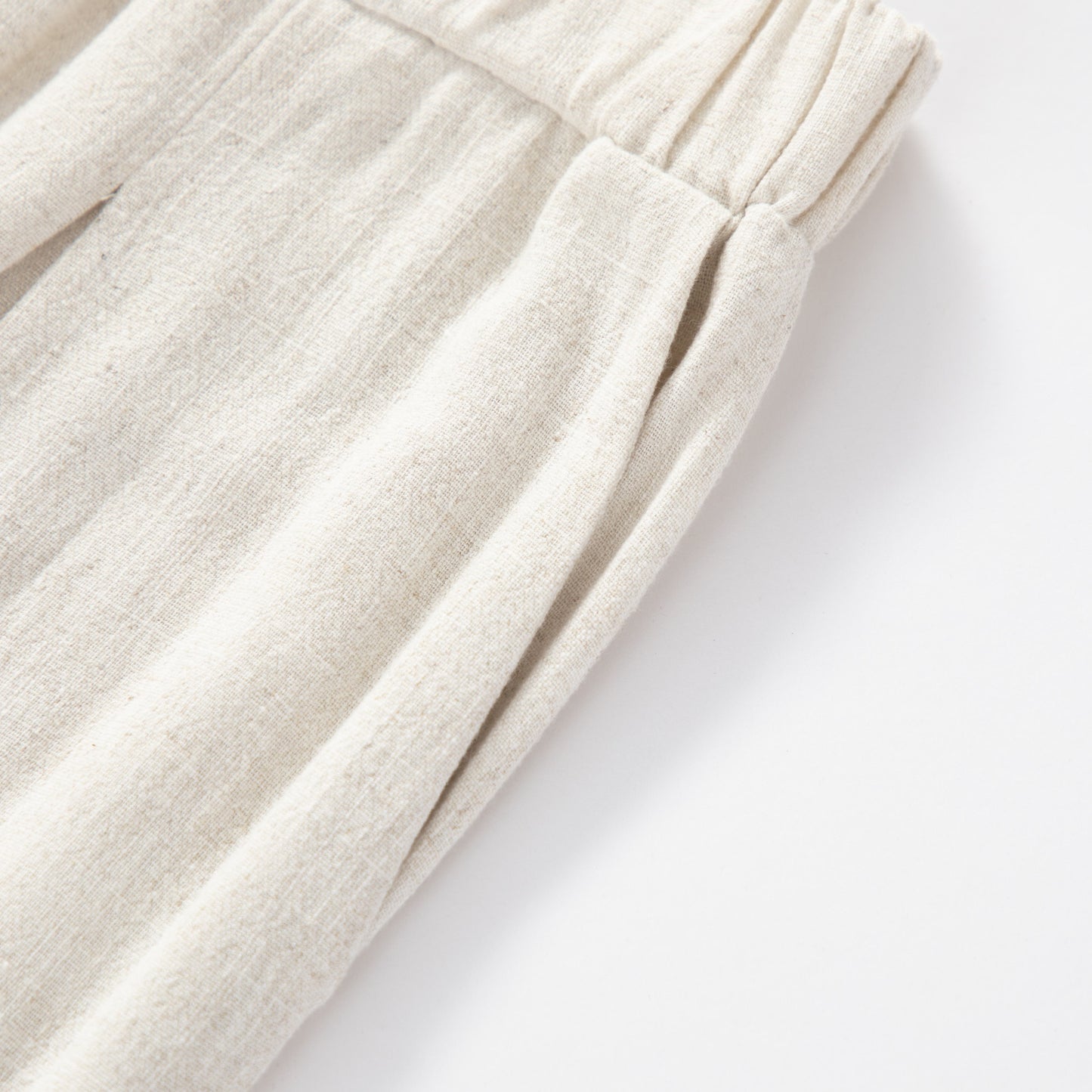 Pantalones holgados de lino sedoso de talle alto y ajuste flojo.