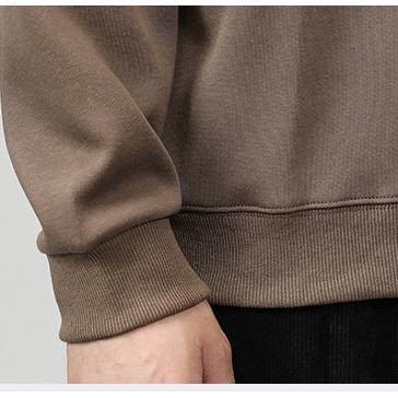 Sweatshirt ample à encolure ras-du-cou et motif en relief décontracté.