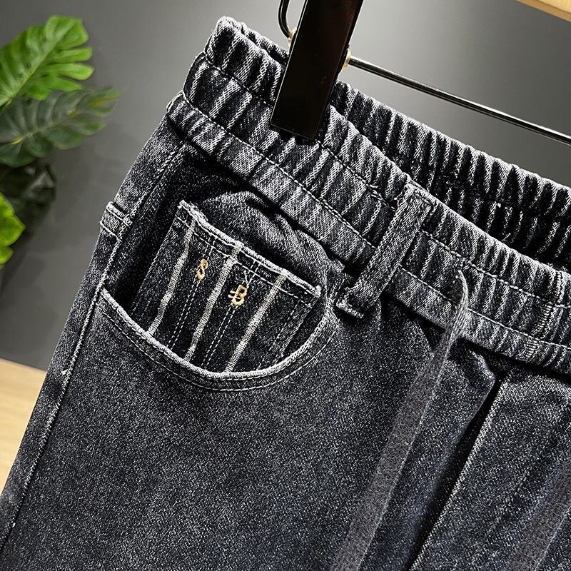 シックなストレートタイプのエラスティックウエスト洗いジーンズ
