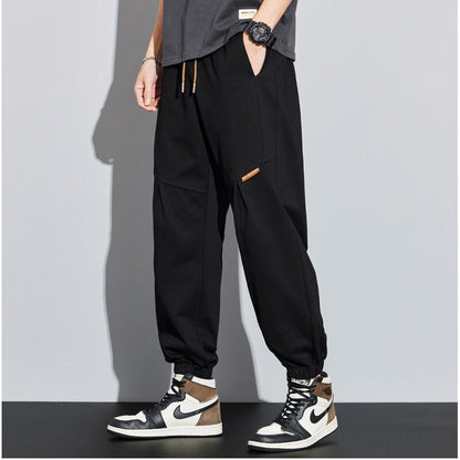 Vielseitige Sweatpants mit lockerem Schnitt und Patchwork im tapered-Stil