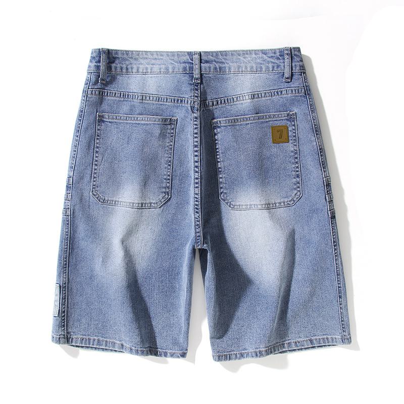 Pantalones cortos de mezclilla sueltos con bolsillos inclinados y elasticidad versátil.