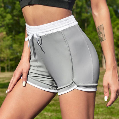 Yoga enganliegende elastische Sportshorts mit niedriger Taille und schmaler Passform