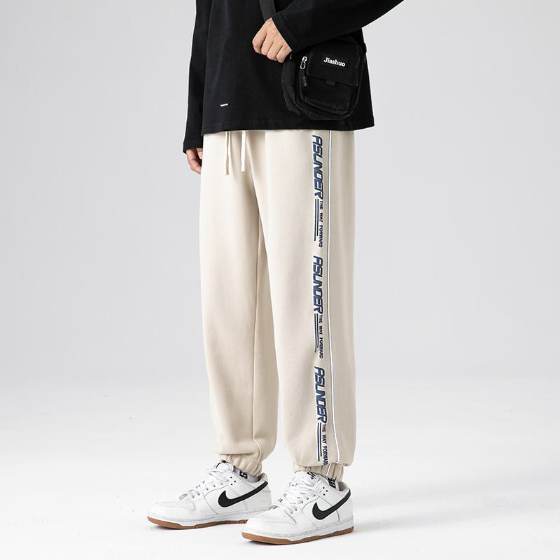 Pantalón deportivo de punto estampado a la moda, ajustado y holgado con cordón