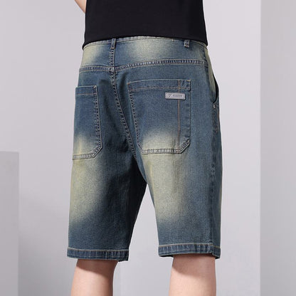 سروال جينز قصير بخصر مطاطي وتصميم عتيق برباط فضفاض.