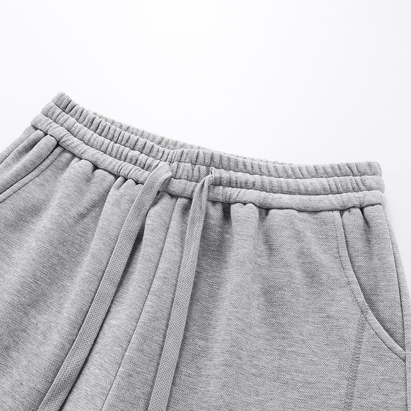 Pantalon de survêtement en tissu de qualité supérieure, polyvalent et avec cordon de serrage.