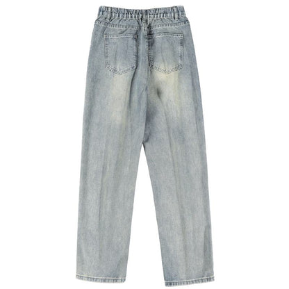 Jeans rectos retro de ajuste holgado, con aspecto desgastado y salpicaduras de tinta casual.