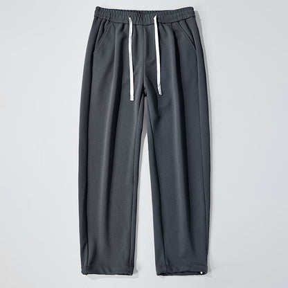 Pantalon ample en tricot confortable, coupe droite et polyvalent, avec élasticité.
