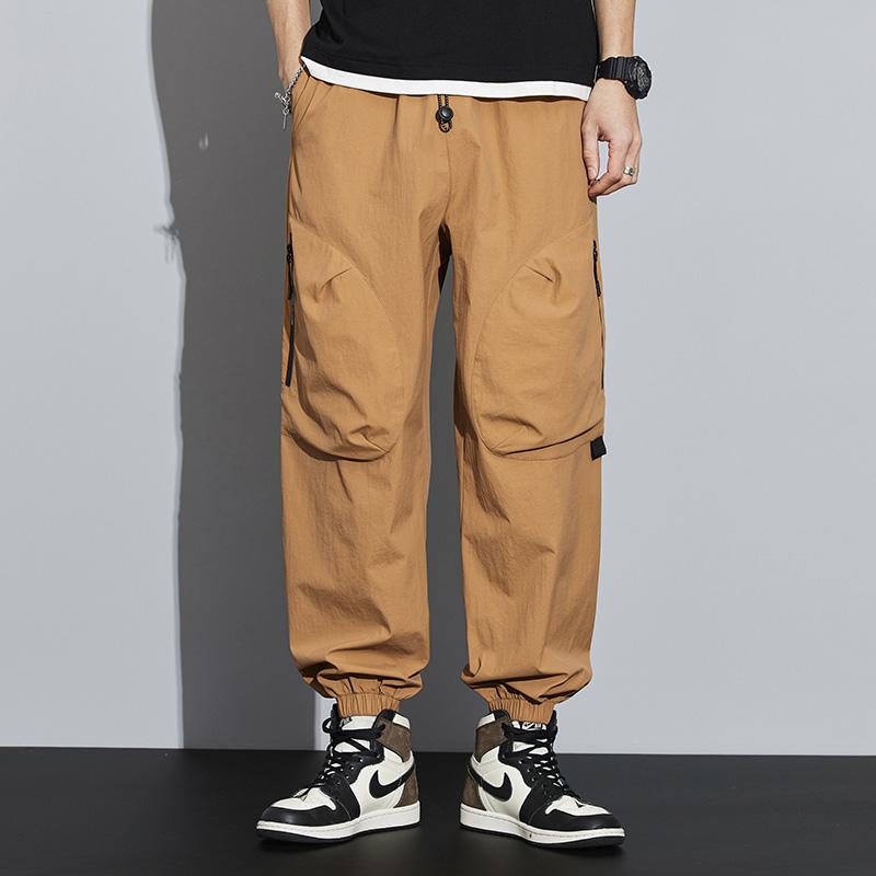 Pantalon cargo solide avec poches zippées et coupe fuselée