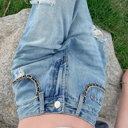Distressed Jeans in bodenlanger Länge mit Stickerei