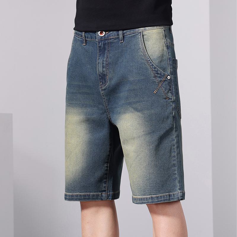 Pantalones cortos de mezclilla lavados de cintura elástica y estilo retro con cordón suelto.
