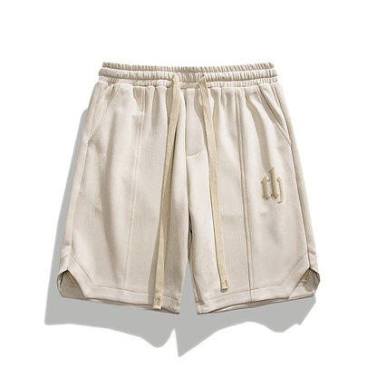 Pantalones cortos de terciopelo camel suelto con cintura de cordón de gamuza estampada versátil.